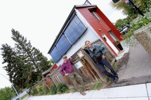 *Homeowner Corelius Koster and Tom Jackman of Simple Solar in front of the net-positive garage suite in Ramsay neighbourhood of Calgary, Alberta. Photo David Dodge, GreenEnergyFutures.ca