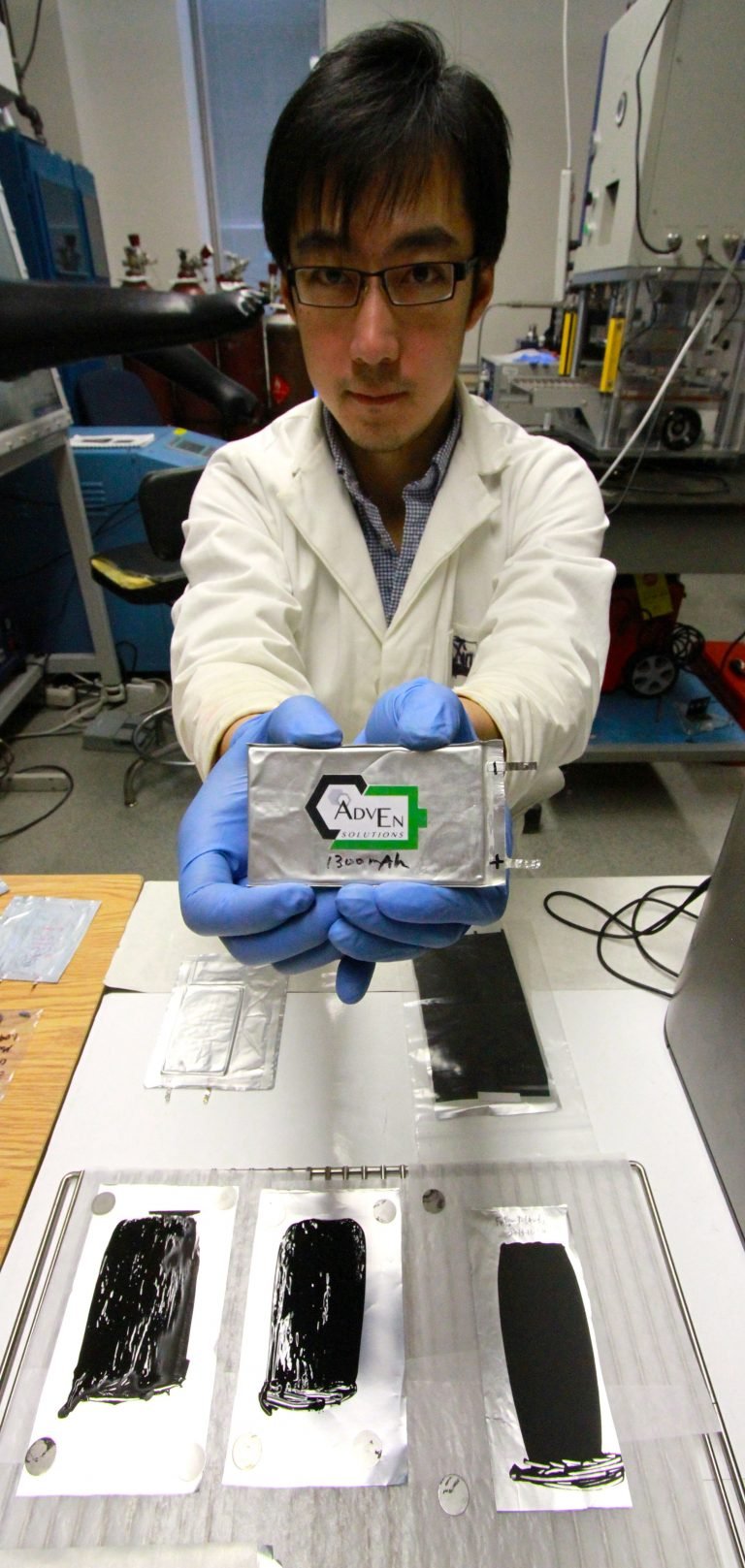 Xinwei Ciu holding one of AdvEN Solutions carbon nanotube prototype