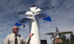 The solar tree behind Mayor Grant was designed and built by Matt Orr a local entrepreneur who added the ornamental solar tree about the same time Vulcan was designing its new solar park to build on its Star Trek theme. Photo David Dodge, GreenEnergyFutures.ca