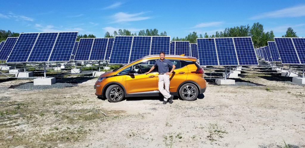 Mike Brigham of SolarShare with his pure electric Chevrolet Bolt