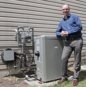 Greg Caldwell with micro cogen unit