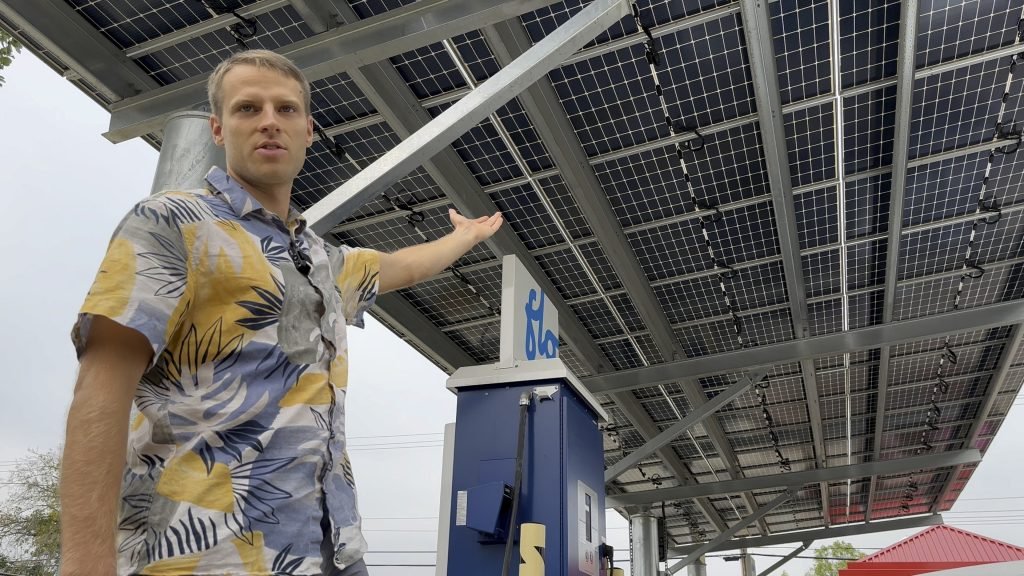 367. Energy managers help small towns and cities save energy and money 13 Nathan gestures to Solar Canopy EV Charging Station1